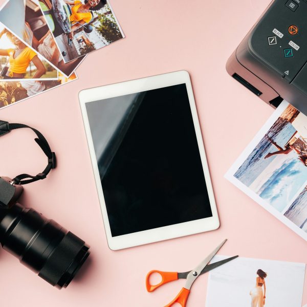 Printer, photo camera and digital tablet on table. Printing photos concept